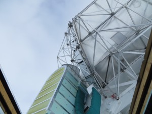 The giant telescope turns toward the open ceiling.