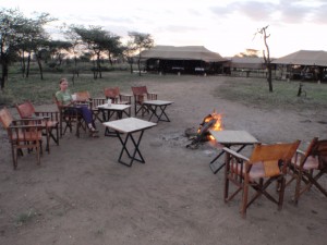 Enjoying a cup of tea by the fire.