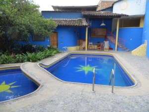 Our room (door behind the pool) at Jardin Escondido hostel in Vilcabamba.