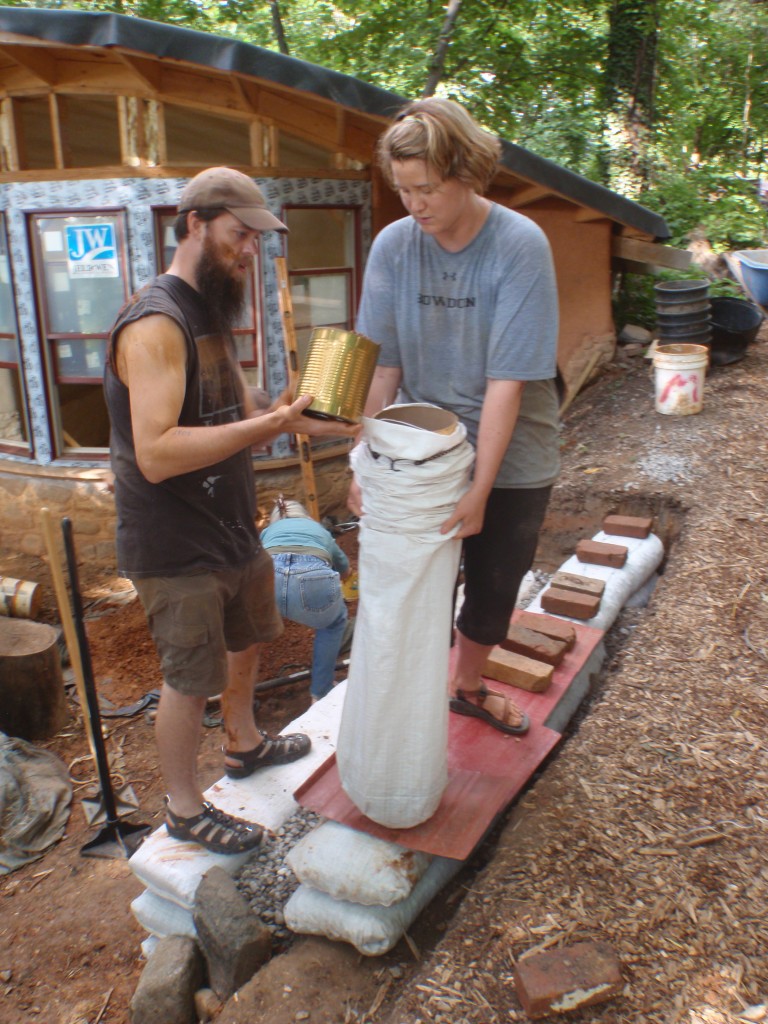 Filling earthbags.